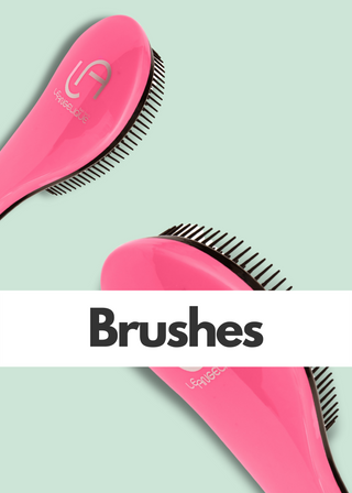 Closeup of pink Le Angelique detangle brush for thick hair.