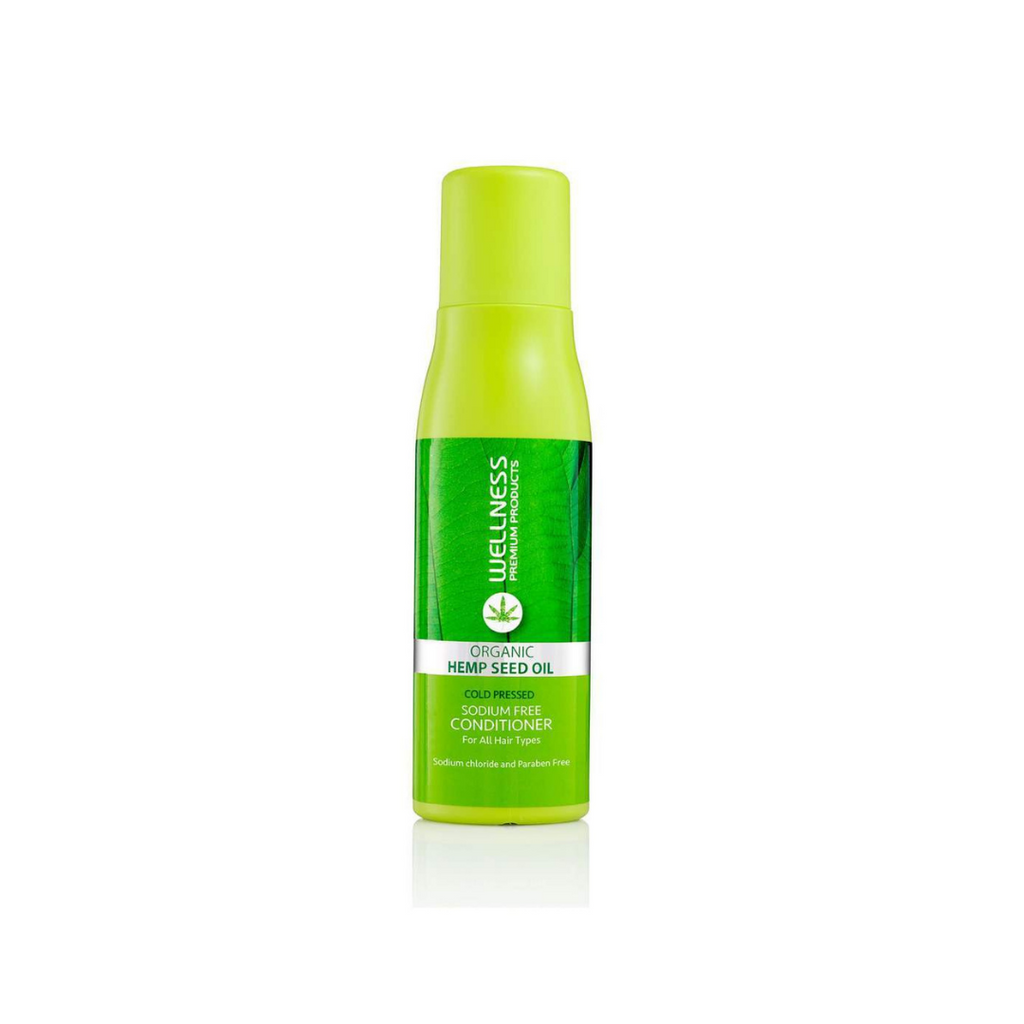 Closeup of green bottle of Wellness brand organic hemp conditioner. 